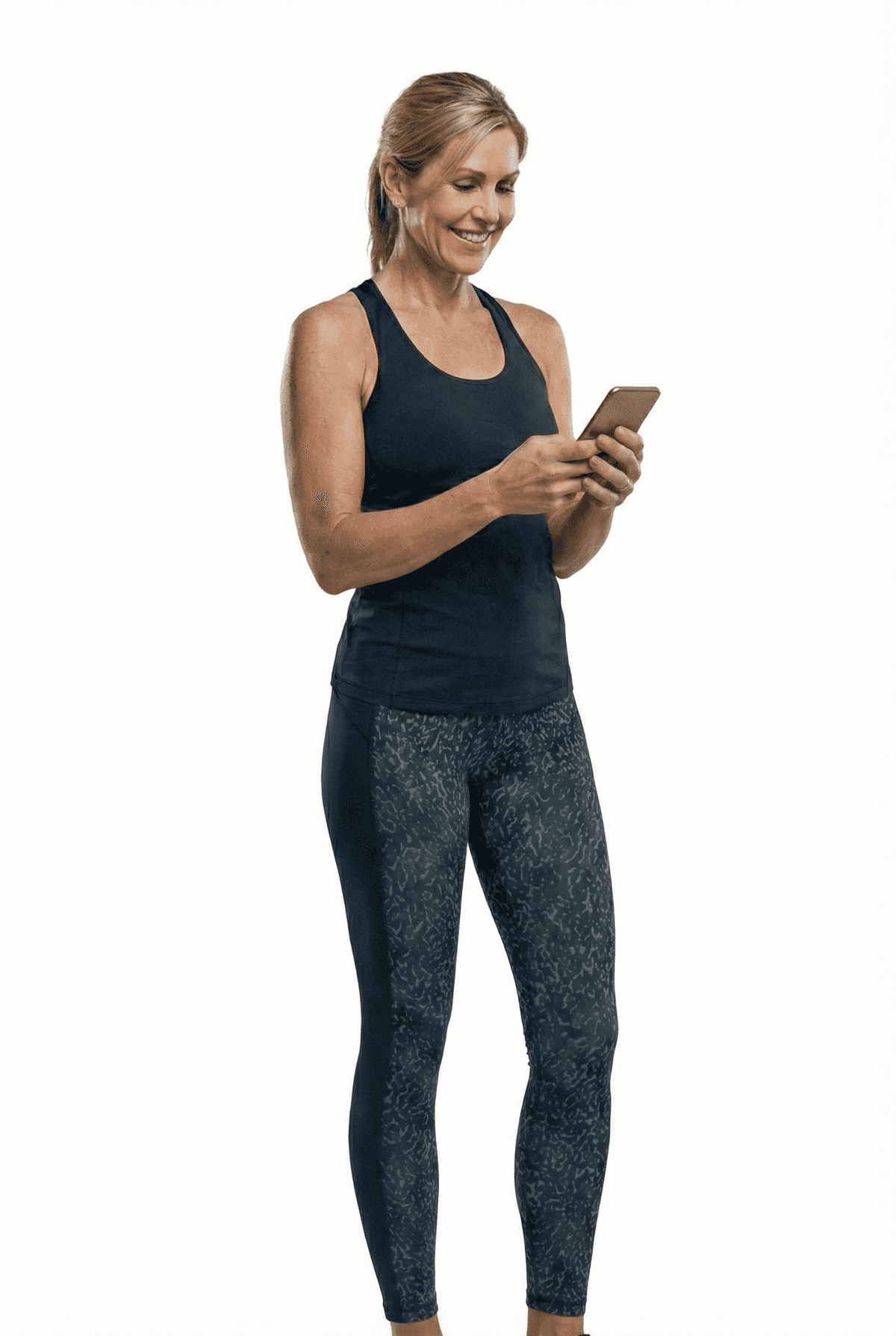 Woman in athletic wear looking at phone